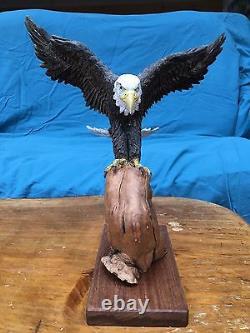 Hand Carved Bass Wood Eagle with Wood Burned Feather Perched Atop Cyprus Branch
