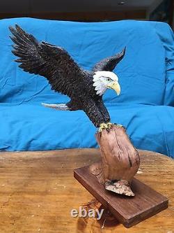 Hand Carved Bass Wood Eagle with Wood Burned Feather Perched Atop Cyprus Branch