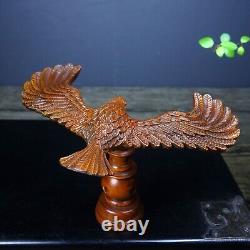 Hand carved boxwood balanced eagle displays its magnificent image