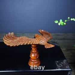 Hand carved boxwood balanced eagle displays its magnificent image