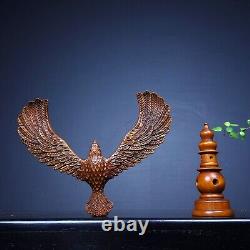 Hand carved boxwood balanced eagle displays its magnificent image