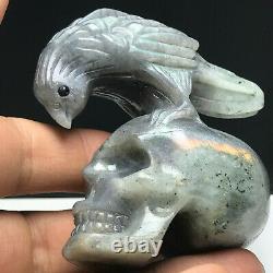 Natural mineral specimen. Labradorite. Hand-carved. Skull and a eagle sculpture