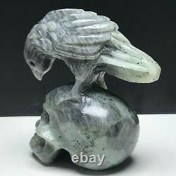 Natural mineral specimen. Labradorite. Hand-carved. Skull and a eagle sculpture