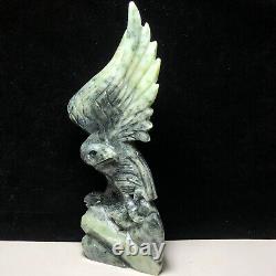 Natural quartz crystal cluster mineral specimen. Dushan Jade. Hand-carved eagle