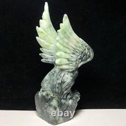 Natural quartz crystal cluster mineral specimen. Dushan Jade. Hand-carved eagle