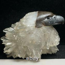 Natural quartz crystal cluster mineral specimen. Fine hand-carved bald eagle