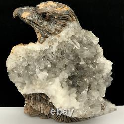 Natural quartz crystal cluster mineral specimen. Hand-carved. The eagle