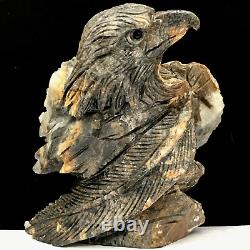 Natural quartz crystal cluster mineral specimen. Hand-carved. The eagle