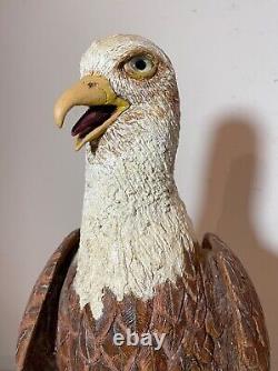 Vintage hand carved wood Folk Art bald eagle bird with fish sculpture statue